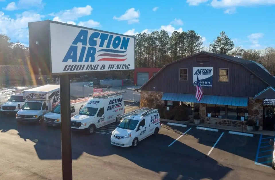 The Action Air main location with service trucks parked out front.